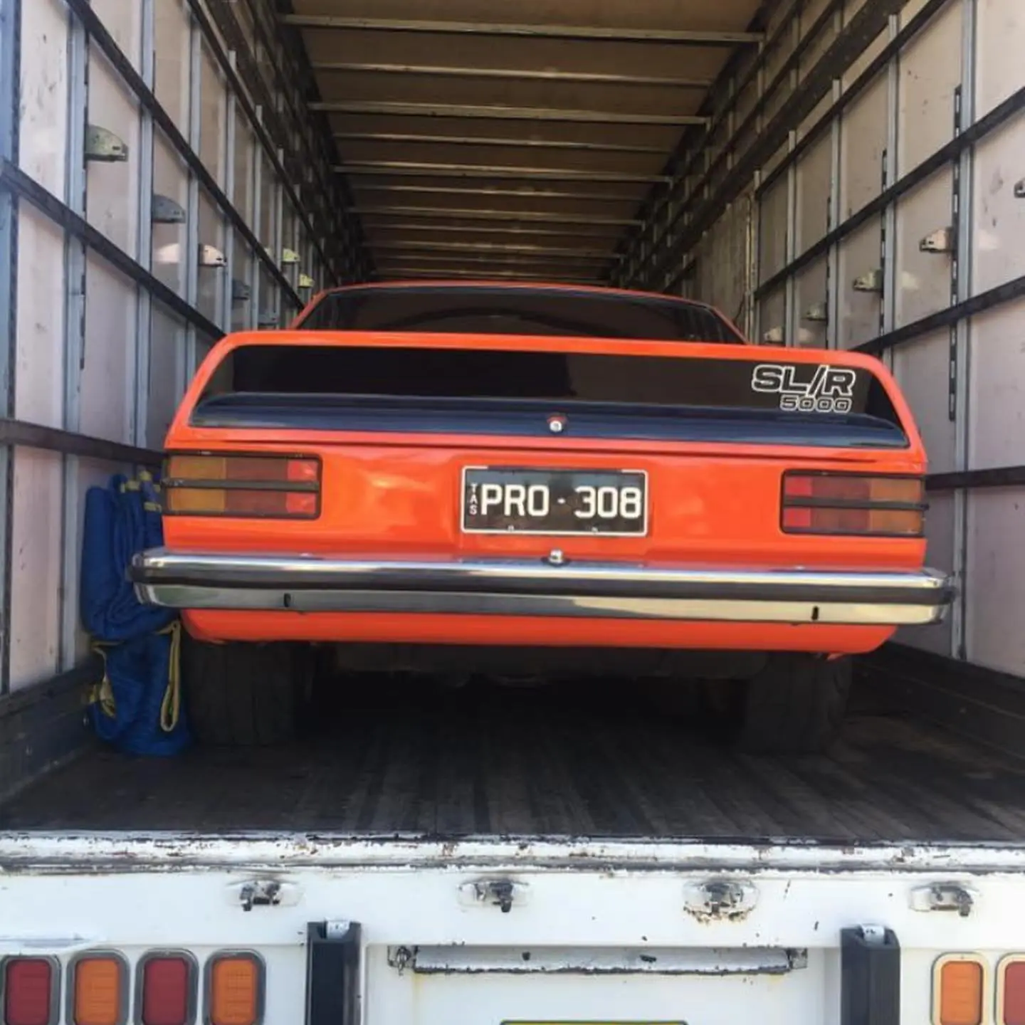 Orange SLR 5000 vehicle in transport