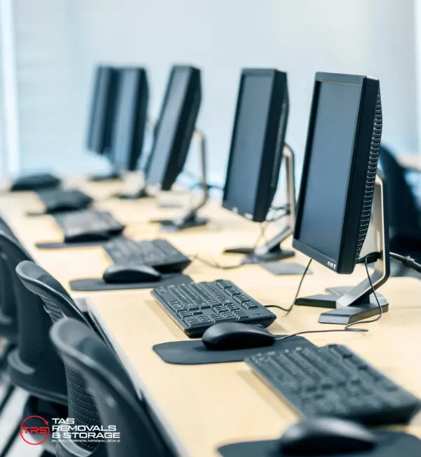 IT relocation and office tech move in Tasmania with labelled network equipment, packed monitors and cable-tagged workstations ready for transport