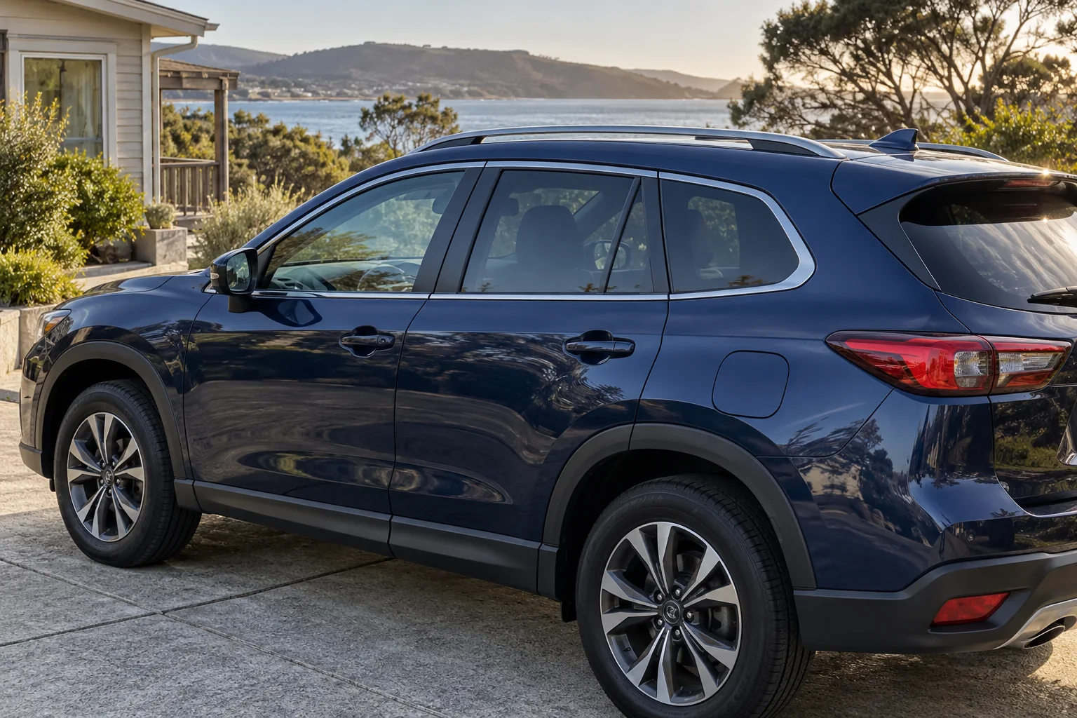 A dark blue SUV parked on a residential driveway