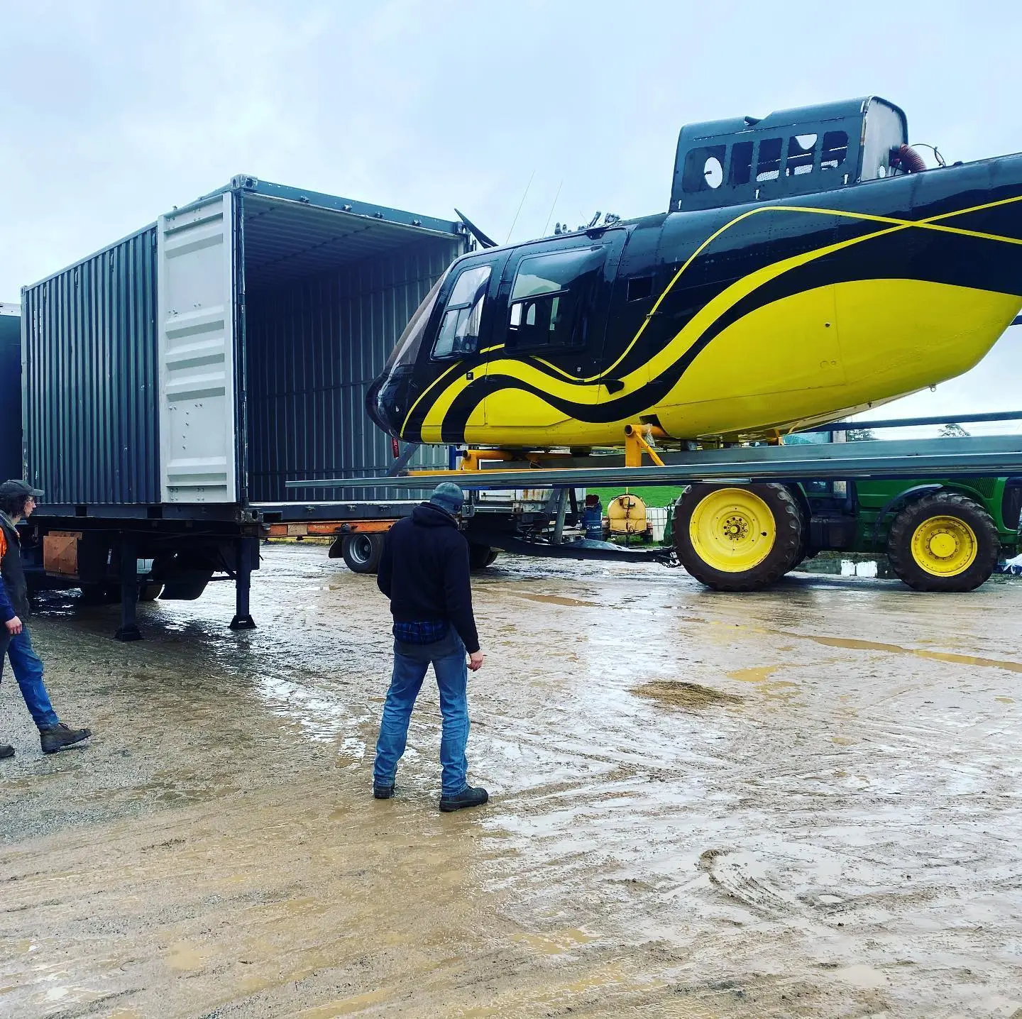 Helicopter being loaded for transport